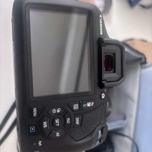 Canon EOS 2000D camera with case and tripod