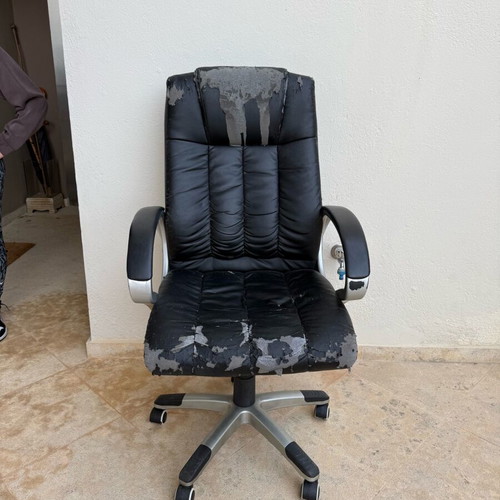 Office chair used with worn covers