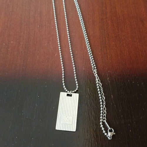 Necklace with decorative plaque like new