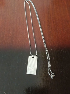 Necklace with decorative plaque like new