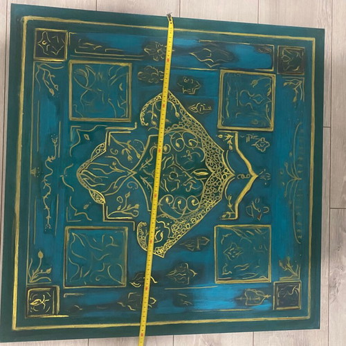 Turquoise board with a gold hamsa hand