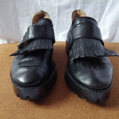 Women's black leather loafers with tassels and snap buttons, size 37