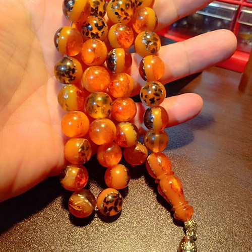 Komboloi worry beads with 33 saffron-colored beads and silk tassel