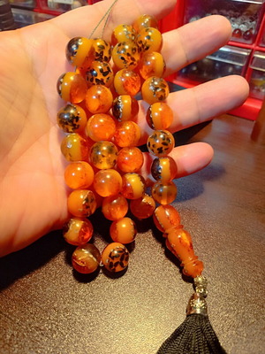 Komboloi worry beads with 33 saffron-colored beads and silk tassel