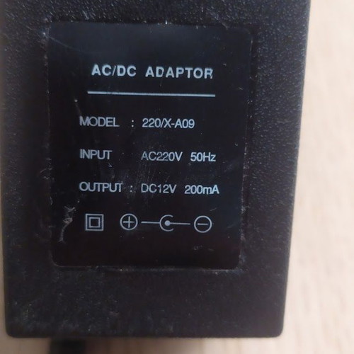 AC/DC adaptor 12V used, model 220/X-A09