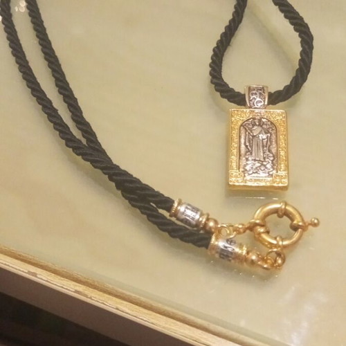 Religious pendant necklace like new, gold and silver