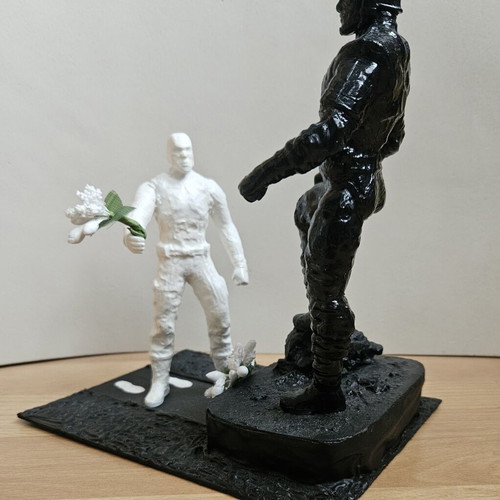 Handmade memorial statue with soldier figure