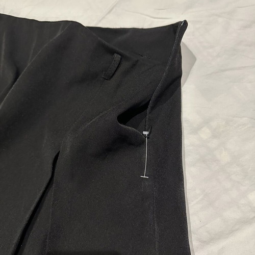 Black pleated mini skirt with hidden zipper