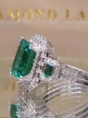 Emerald ring new, silver plated metal with white topaz
