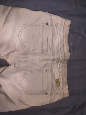 Women's pants used, beige, size 42 with stain