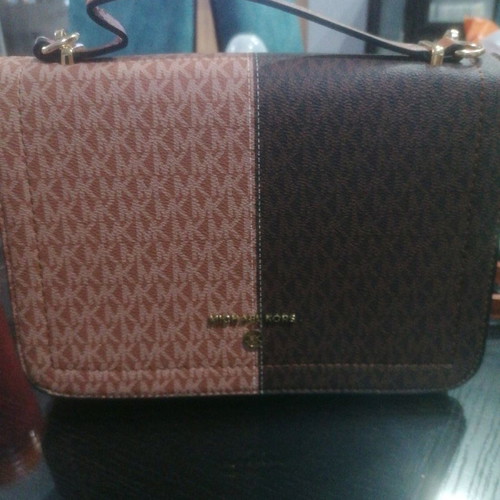 Shoulder bag used with strap for shoulder and hand