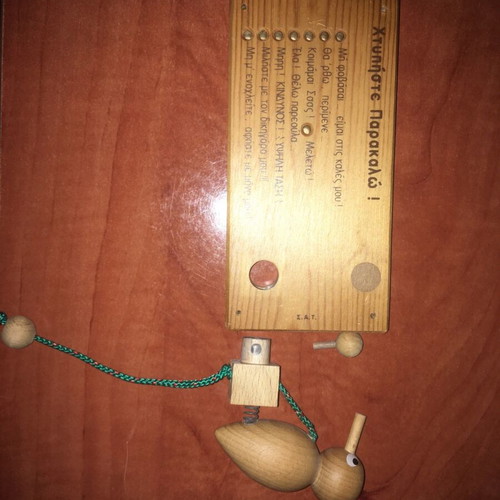 Wooden decorative children's door sign used with woodpecker