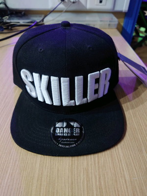 Skiller collectible hat new, black and yellow