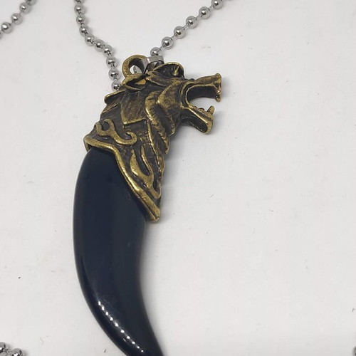 Necklace with wolf tooth pendant like new, gold and black