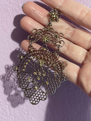 Long gold-plated earrings used with bronze-tone rhinestones