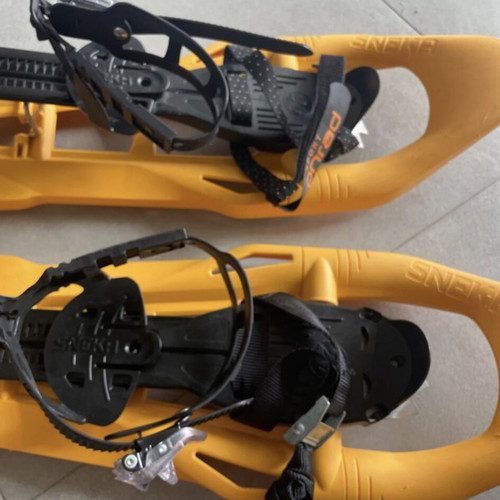 Sneka snowshoes used for hiking with metal crampons