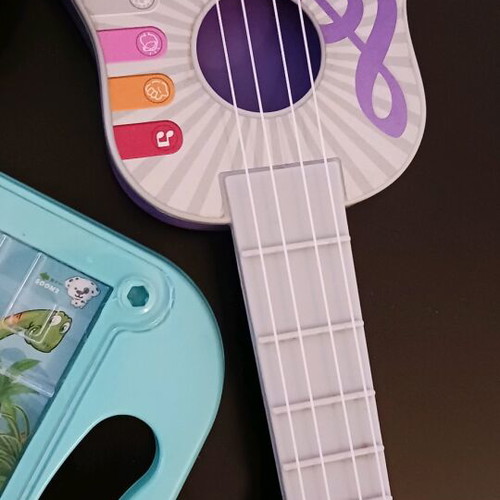 Gift set of 5 items like new with doll, ukulele, fan, puzzle and marble game