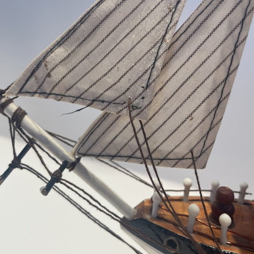 Vintage wooden decorative ship like new with striped sails and wooden base