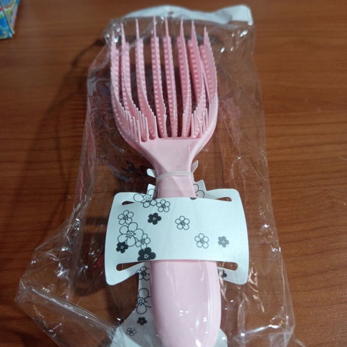 Pink detangling hair comb