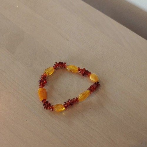 Amber bracelet like new with elastic, brown and orange