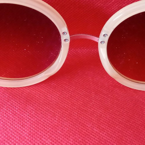 Sunglasses used, beige color