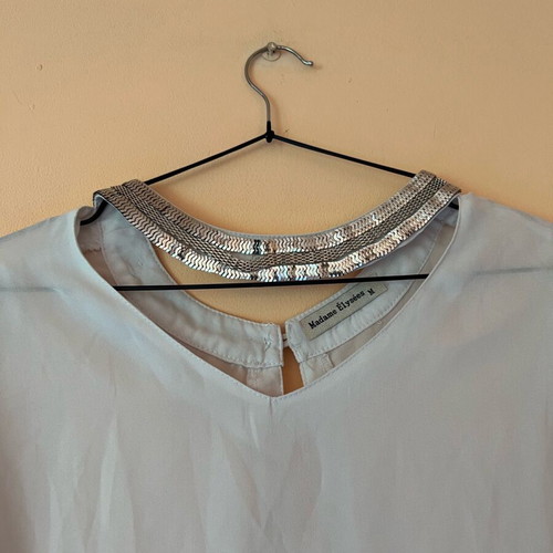 White blouse with silver details around neckline size M like new