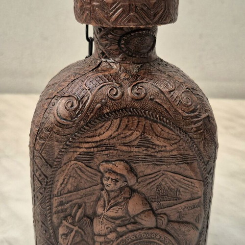 Vintage glass bottle with embossed leather Cervantes & Don Quixote