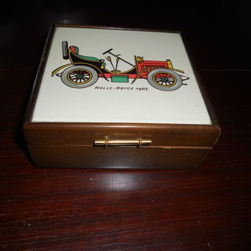 Wooden box used with car illustration on ceramic tile