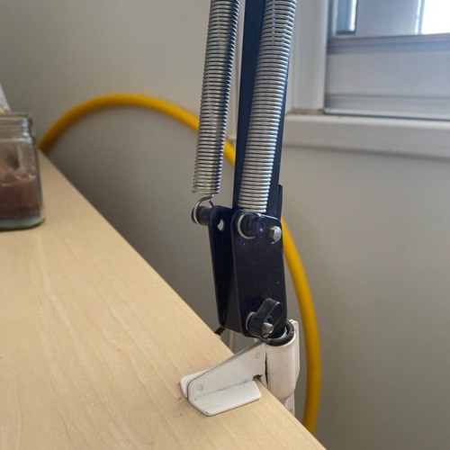 Black screw-on desk lamp used, industrial design