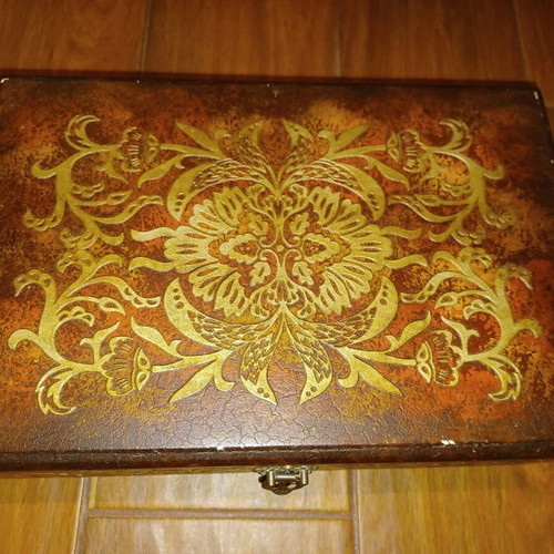 Wooden antique box used with embossed bronze decorations