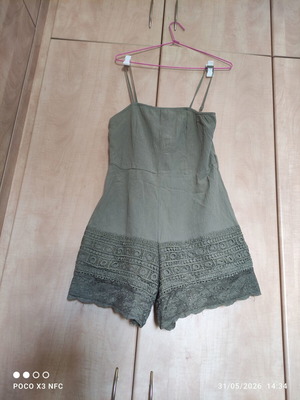 Women's lace romper used, size Medium, adjustable straps