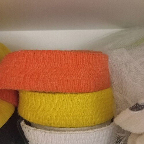 Karate belts orange, white, yellow