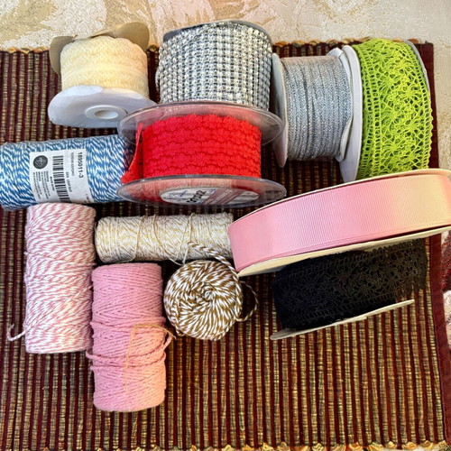 Decorative ribbons, cords, lace and craft elements like new
