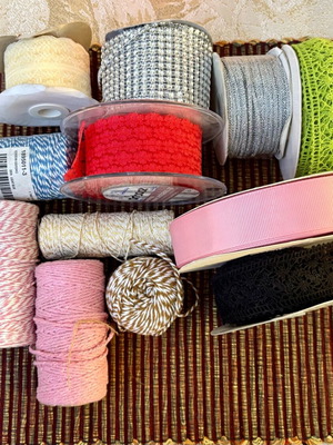 Decorative ribbons, cords, lace and craft elements like new