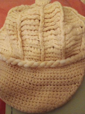 Handmade jockey hat used, yellow with white cord