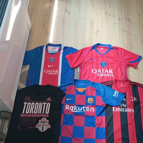 Set of 5 football jerseys including PSG, AC Milan, Barcelona, Toronto FC
