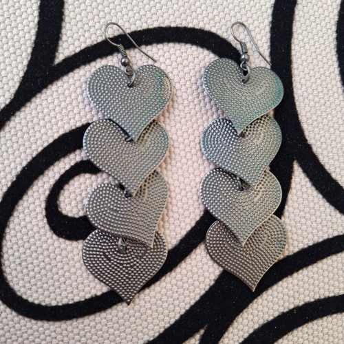 Metal heart earrings like new, gray