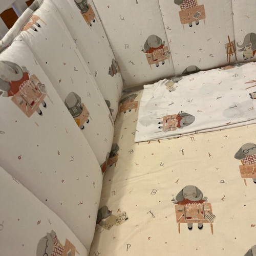 Baby cot like new with unused bedding set and cot bumper