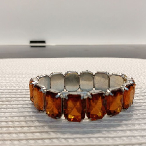 Women's bracelet with large polyhedral inserts, like new, cognac shade
