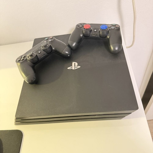 PlayStation 4 1TB like new, 2 consoles with 5 games