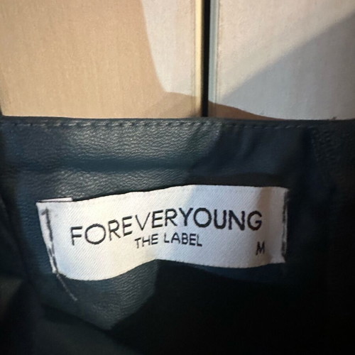 Forever Young leatherette top in cypress color like new, size M