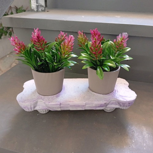 Composition new with handmade plaster base and two pots with artificial plants
