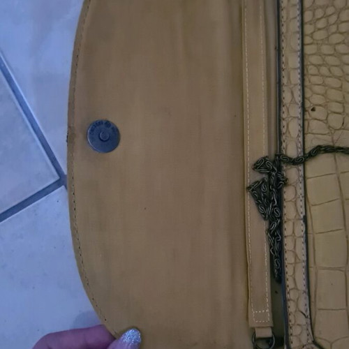 Mustard clutch bag used with minor damages
