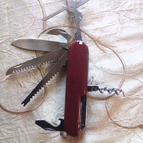 Multitool pocket knife like new with saws, screwdriver, scissors, and more