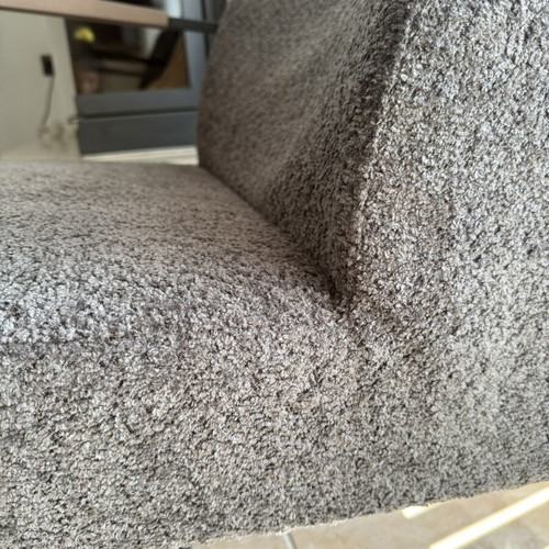 Rocking armchair with grey boucle fabric