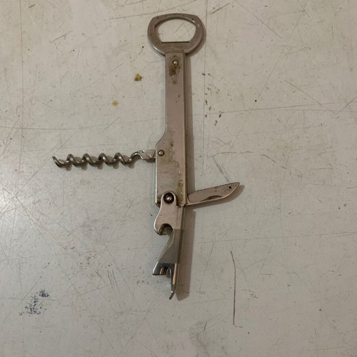 Vintage metal corkscrew bottle opener used