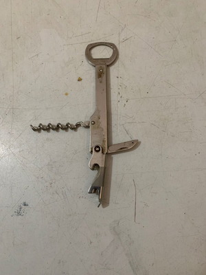 Vintage metal corkscrew bottle opener used