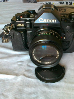 Canon A1 camera like new with flash, telephoto lens, and tripod