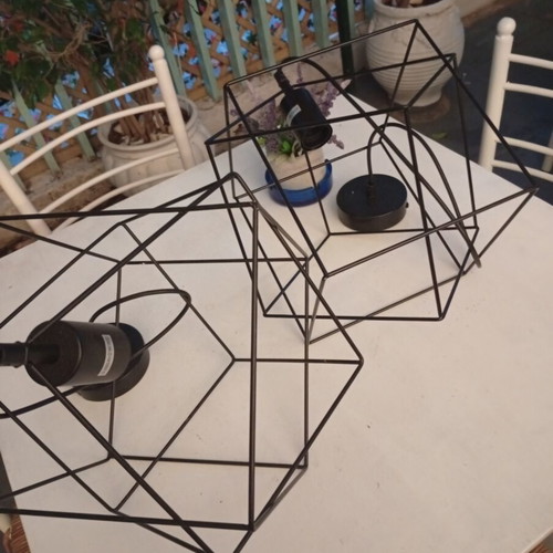 Two rhombic metal ceiling lights