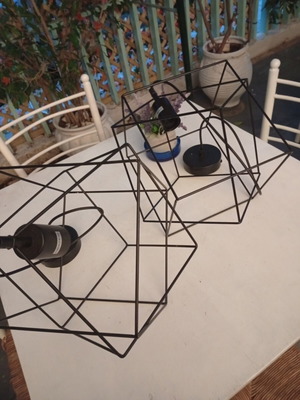 Two rhombic metal ceiling lights